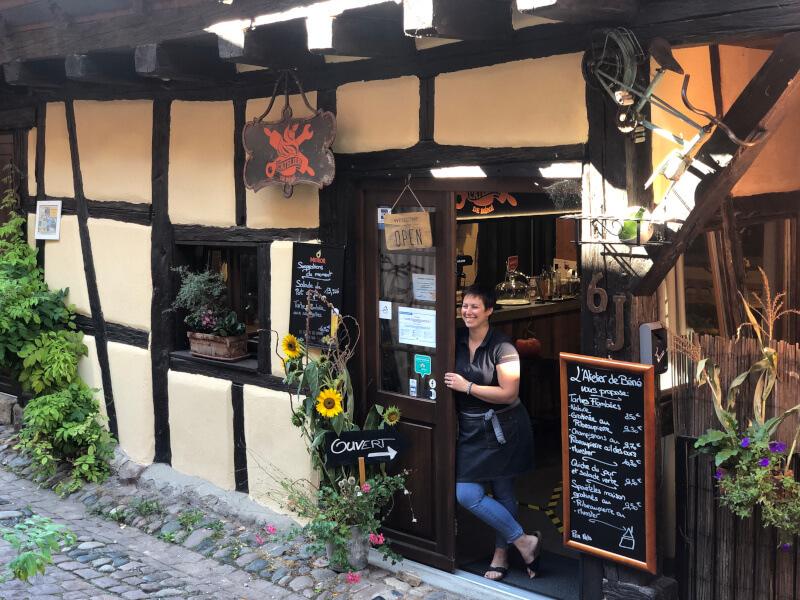 Shop owner touring Alsace Wine Region France walking tour